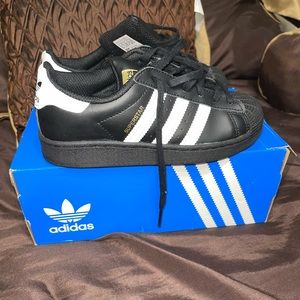 Black and white Shell Toe Adidas